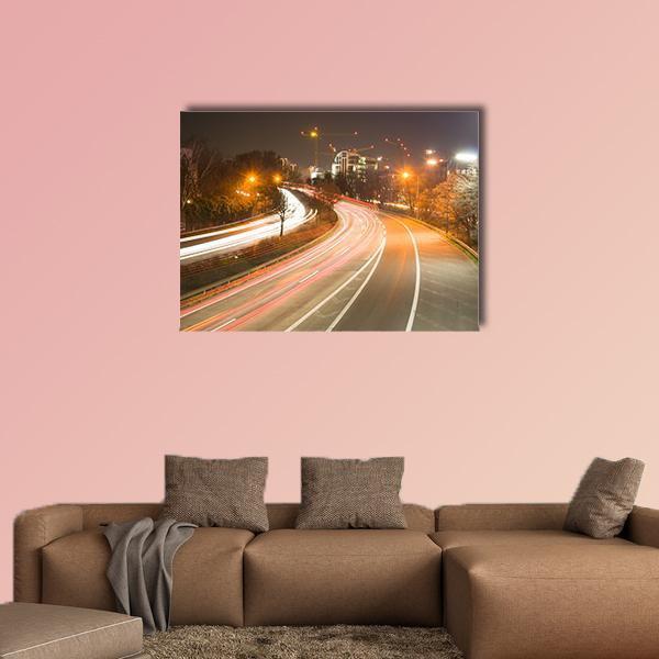 Duesseldorf Night Highway Light Trails Canvas Wall Art in black, white and orange, single panel hung on a wall