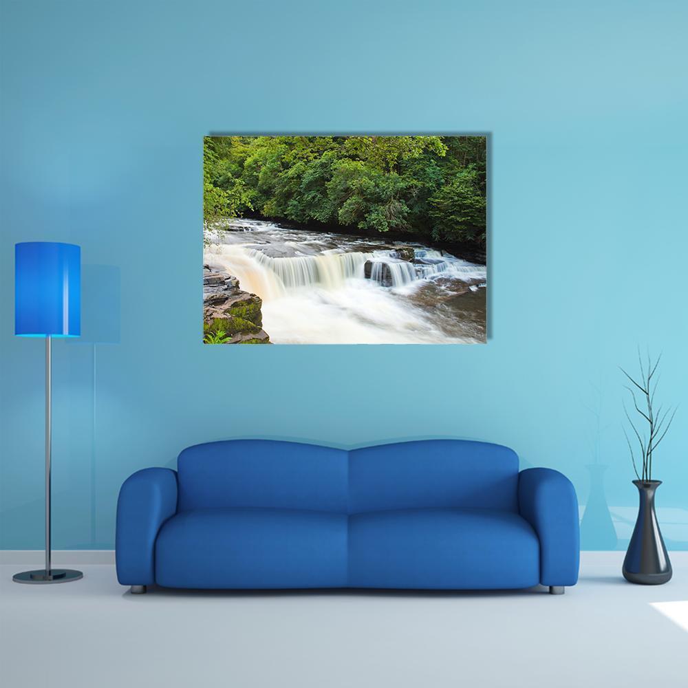 Dundaff Linn Waterfall Canvas Wall Art in white, brown and green, single panel hung on a wall