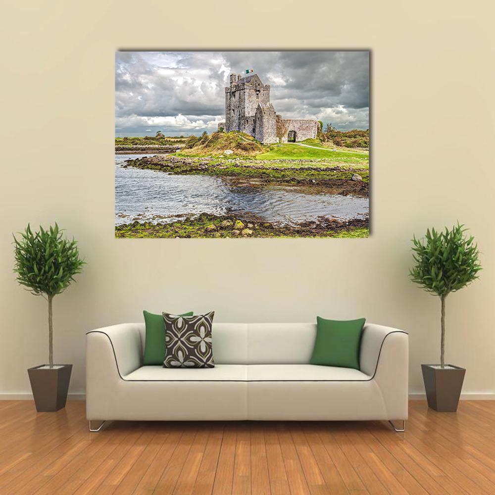Dunguaire Castle Over Rocky Shoreline Canvas Wall Art in gray, green and blue, single panel hung on a wall