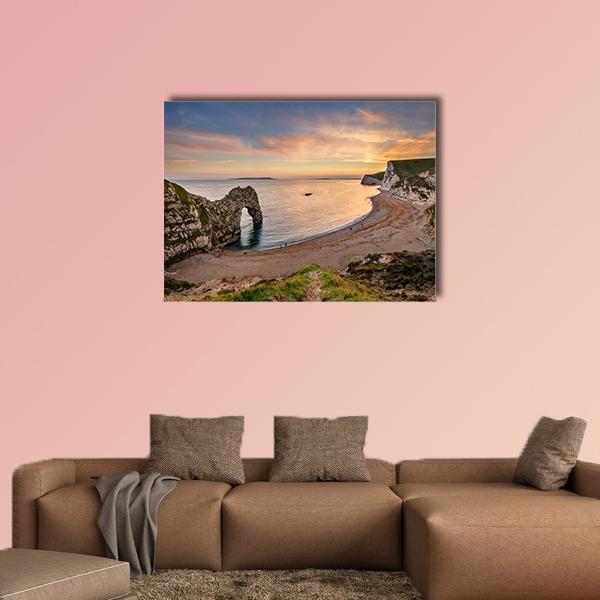 Durdle Door at Sunset Canvas Wall Art in brown, orange and blue, single panel hung on a wall