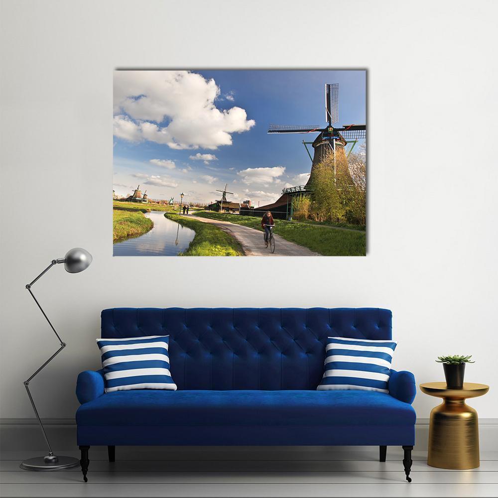 Dutch Windmills by Canal in Amsterdam Canvas Wall Art in brown, green and blue, single panel hung on a wall