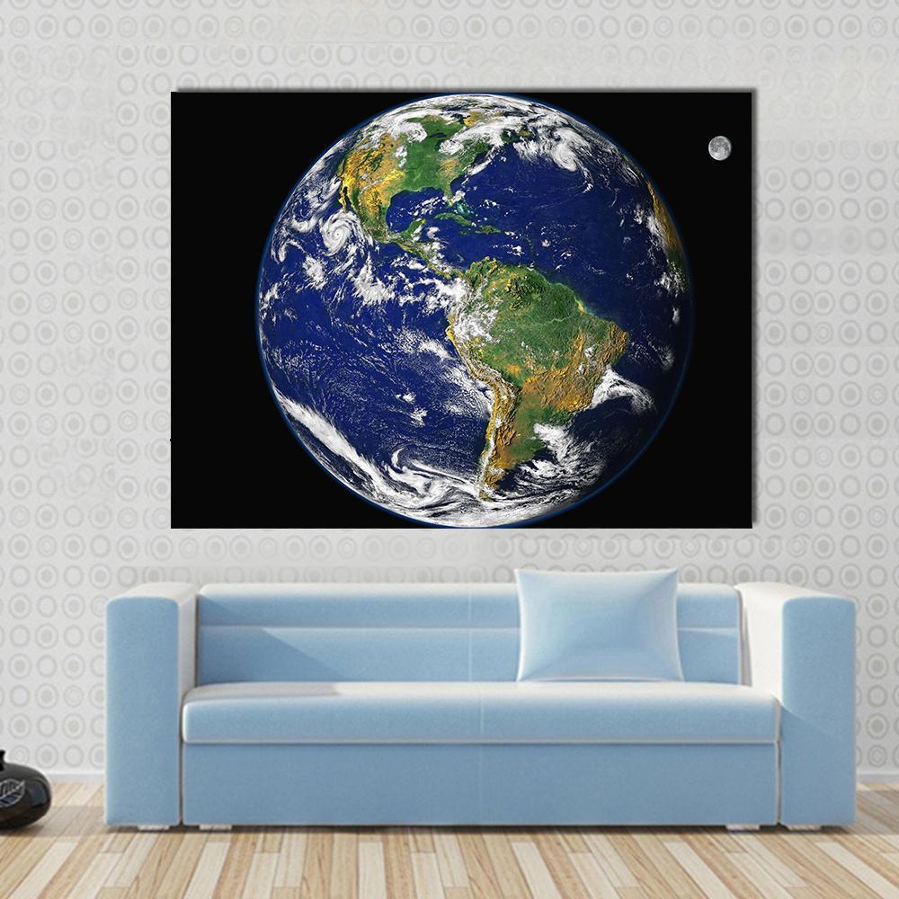 Earth and Moon from Space Canvas Wall Art in black, white and blue, single panel hung on a wall