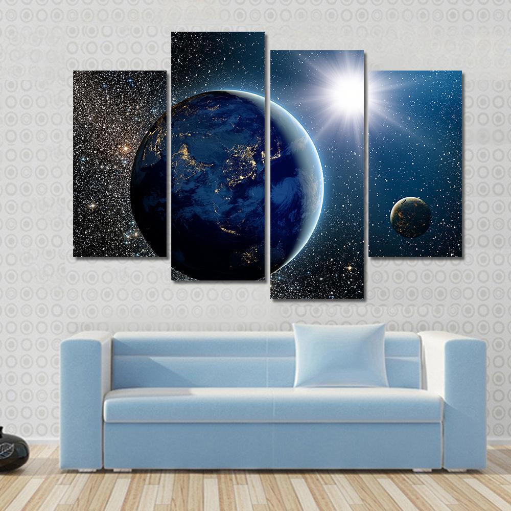 Earth & Sun from Space Canvas Wall Art in black, white and blue, 4 panel Pop layout hung on a wall