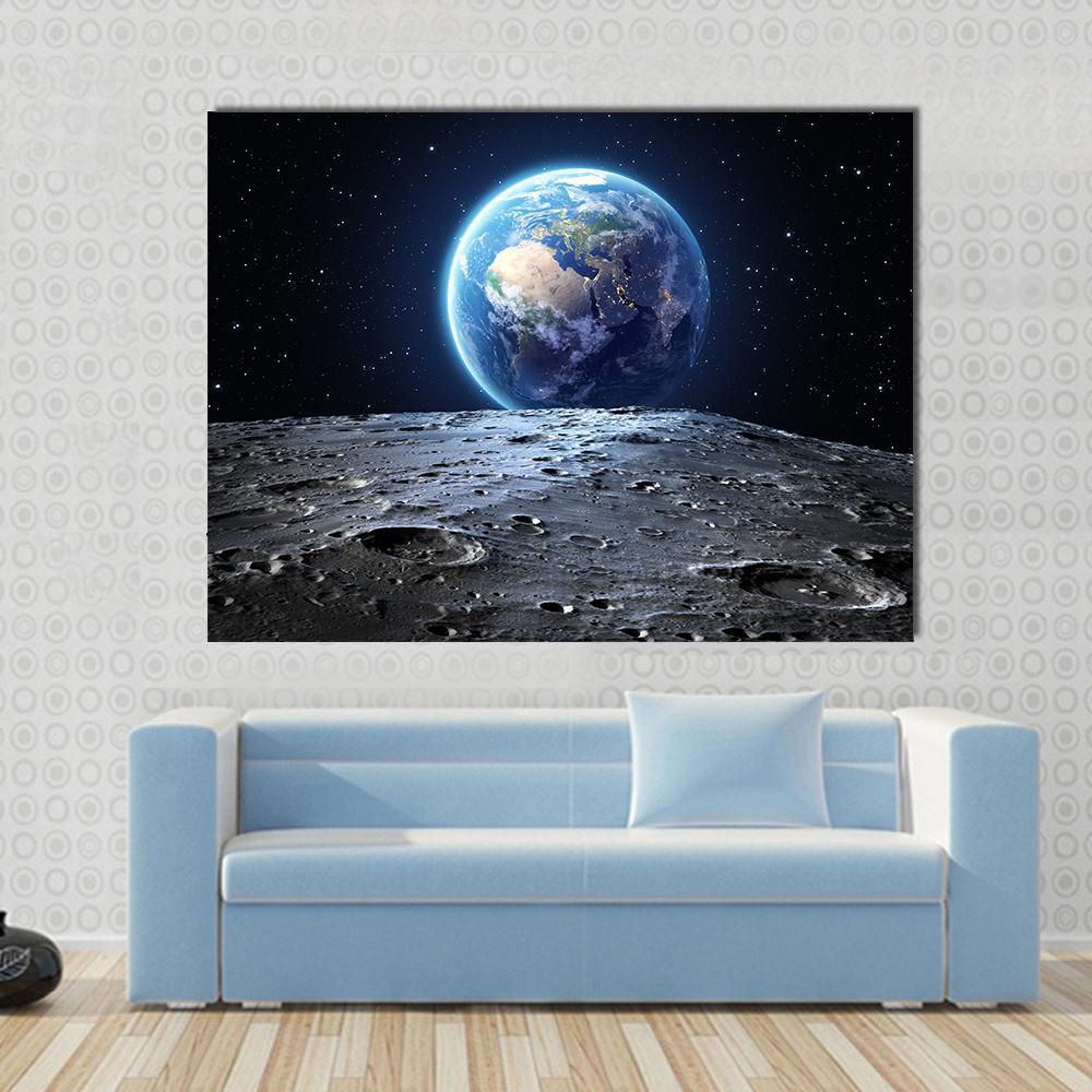 Earth from Moon Surface Canvas Wall Art in black, gray and blue, single panel hung on a wall