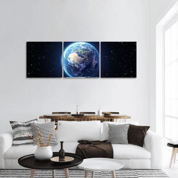 Earth Seen from the Moon Panoramic Canvas Wall Art in black and blue, hung on a wall