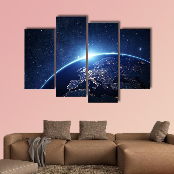 Earth from Space Canvas Wall Art in black and blue, 4 panel Pop layout hung on a wall