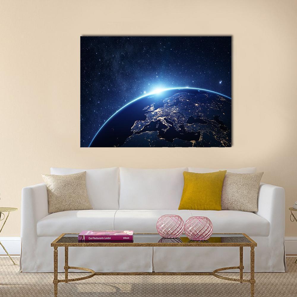 Earth Sunrise Over Europe Canvas Wall Art in black, blue and navy, single panel hung on a wall