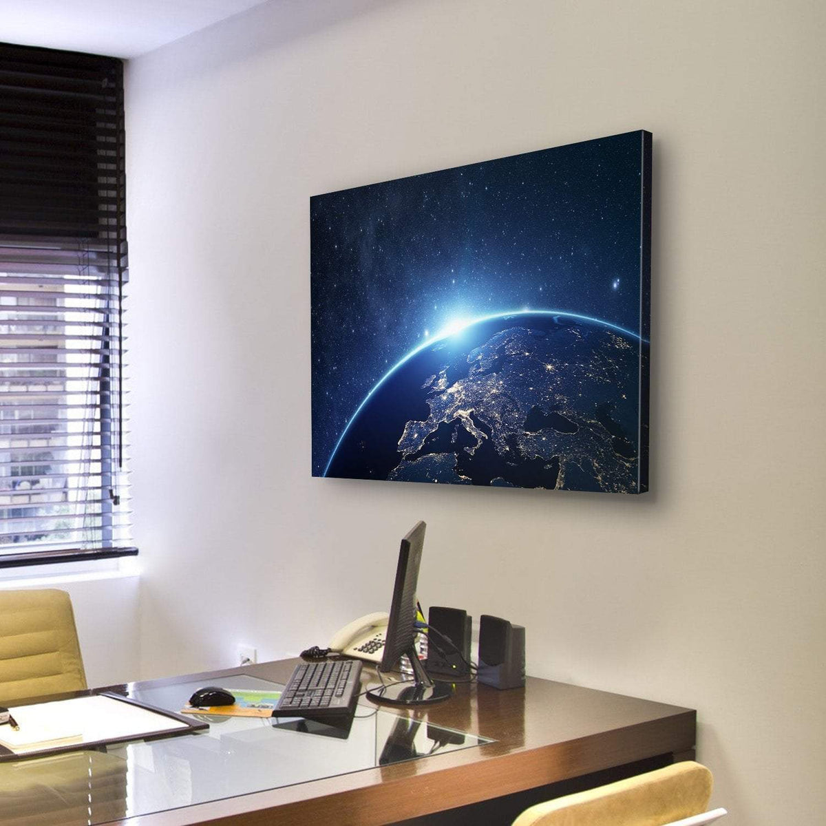 Earth from Space Canvas Wall Art in black and blue, single panel hung on a wall