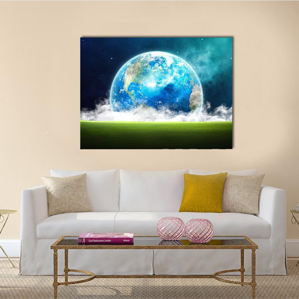 Earth Rising Over Green Field Canvas Wall Art in black, green and blue, single panel hung on a wall