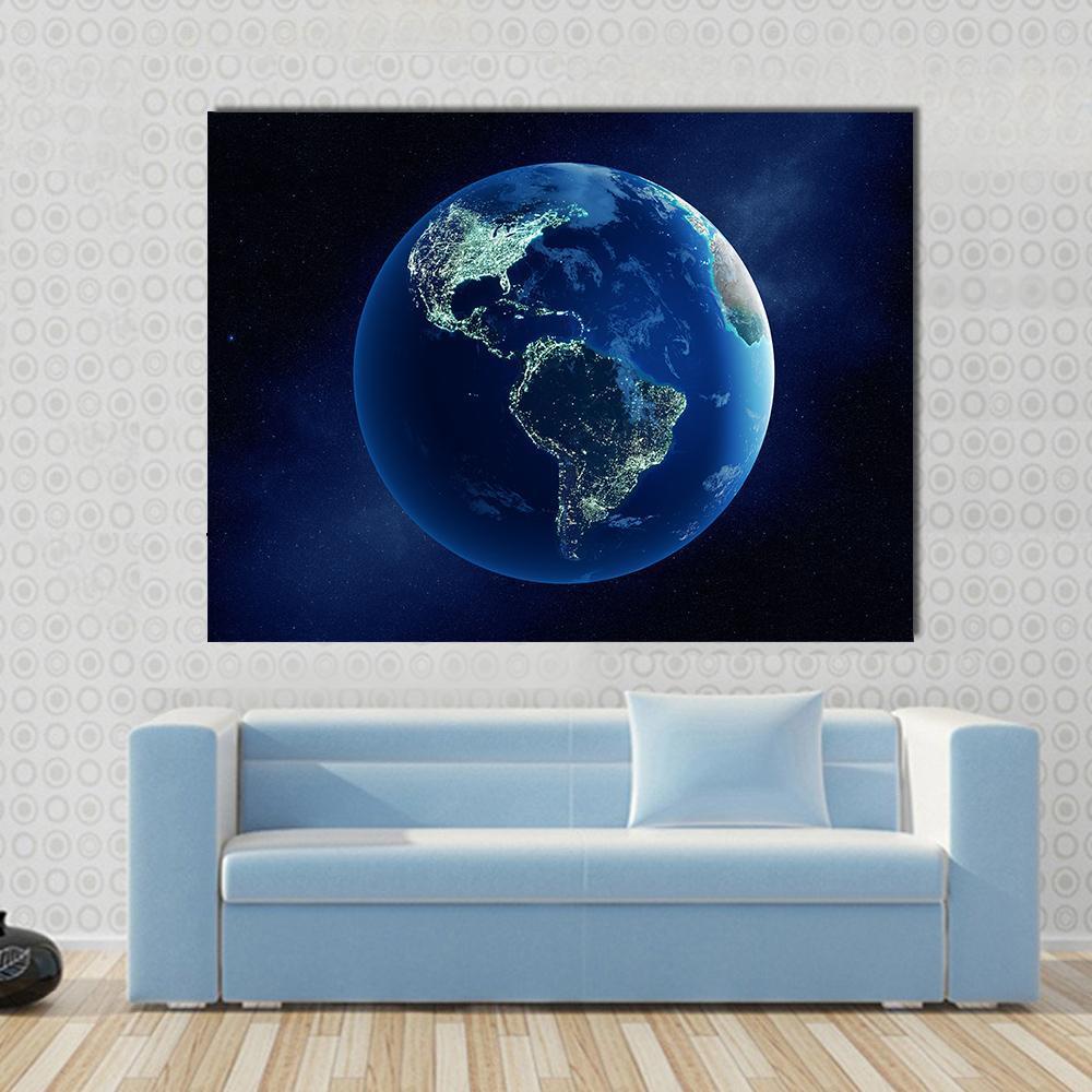 Earth with City Lights Canvas Wall Art in black and blue, single panel hung on a wall