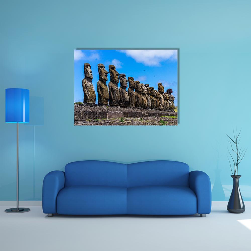 Easter Island Moai Statues Canvas Wall Art in gray, brown and blue, single panel hung on a wall