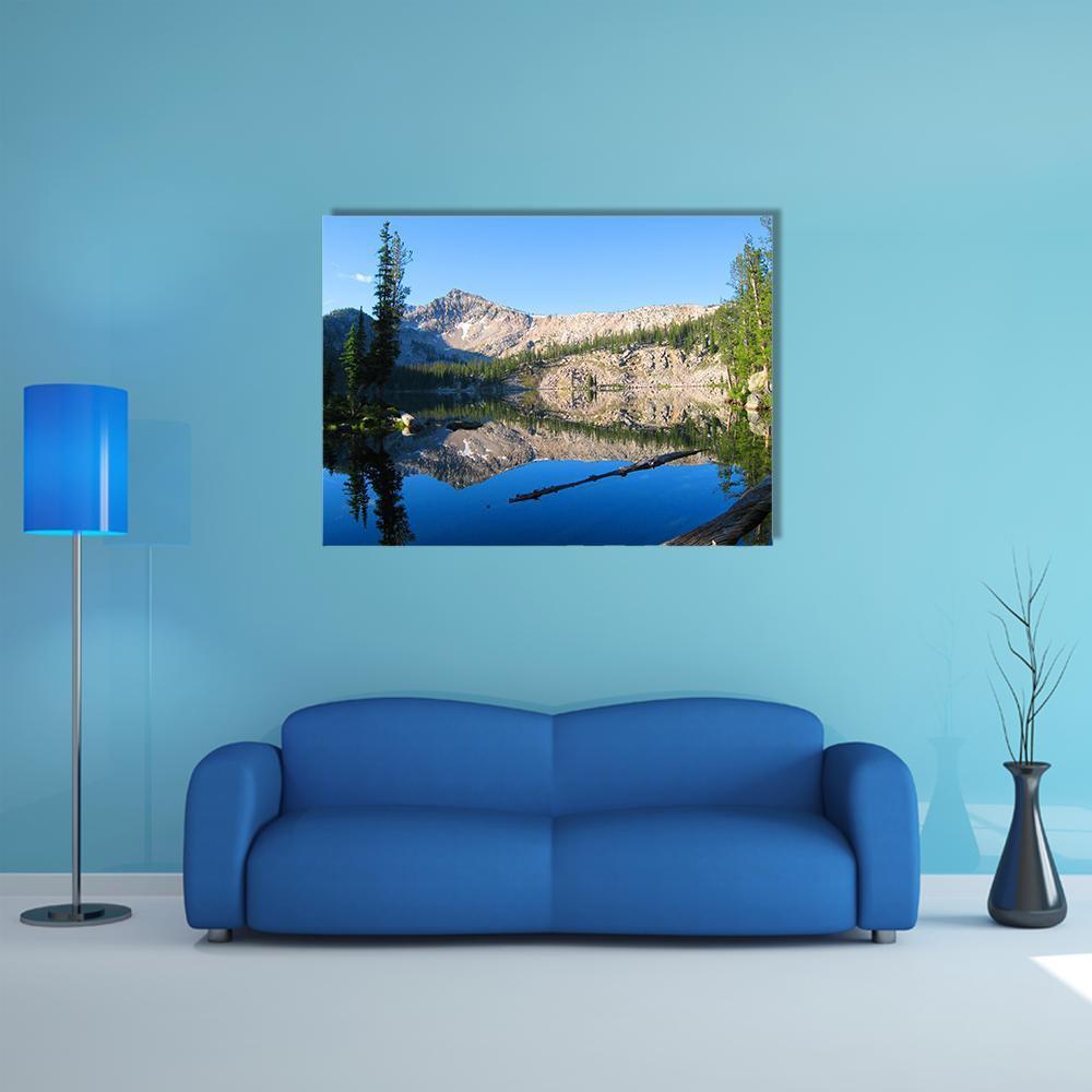 Edna Lake Reflection Canvas Wall Art in gray, green and blue, single panel hung on a wall