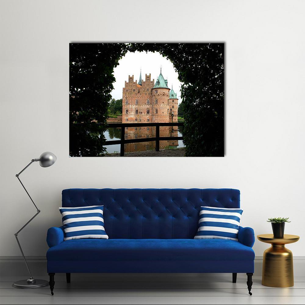Egeskov Castle Moat and Turrets Canvas Wall Art in black, brown and green, single panel hung on a wall