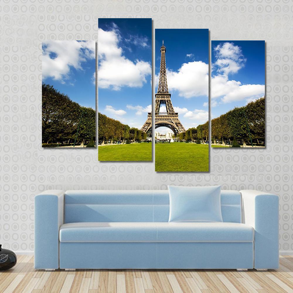 Eiffel Tower Paris Canvas Wall Art in white, green and blue, 4 panel Pop layout hung on a wall