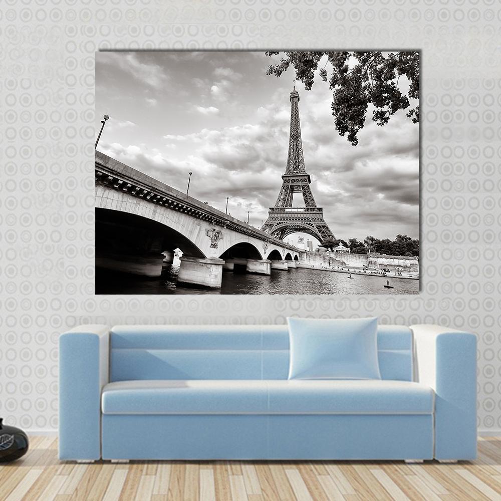 Eiffel Tower from Seine River Canvas Wall Art in black, white and gray, 4 panel Pop layout hung on a wall
