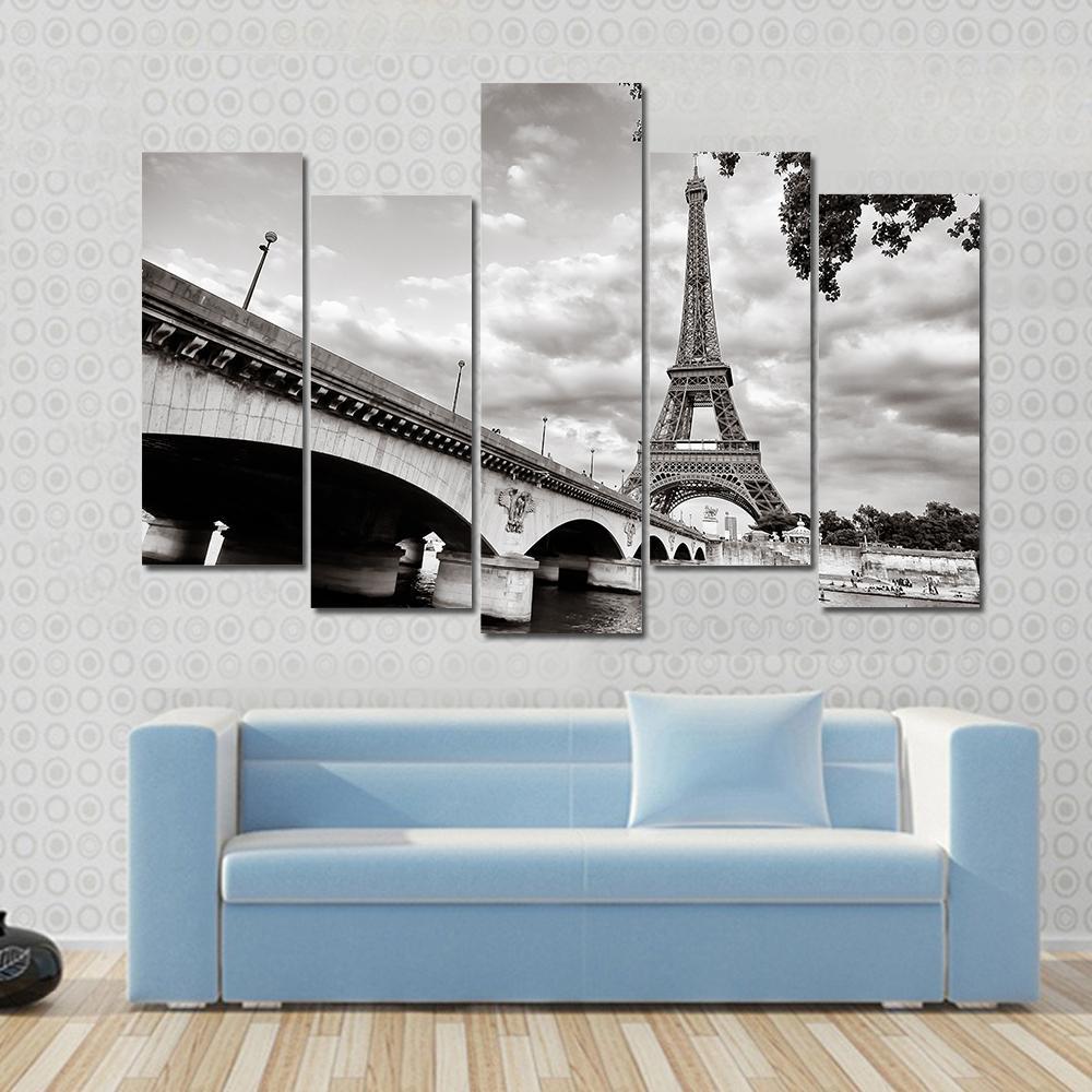 Eiffel Tower from Seine River Canvas Wall Art in black, white and gray, 5 panel Pop layout hung on a wall