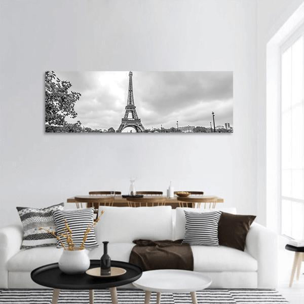 Eiffel Tower from the Seine Panoramic Canvas Wall Art in black, white and gray, hung on a wall