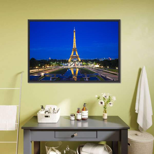 Eiffel Tower Illuminated at Twilight Canvas Wall Art in gold, yellow and blue, framed canvas, product view on a white background