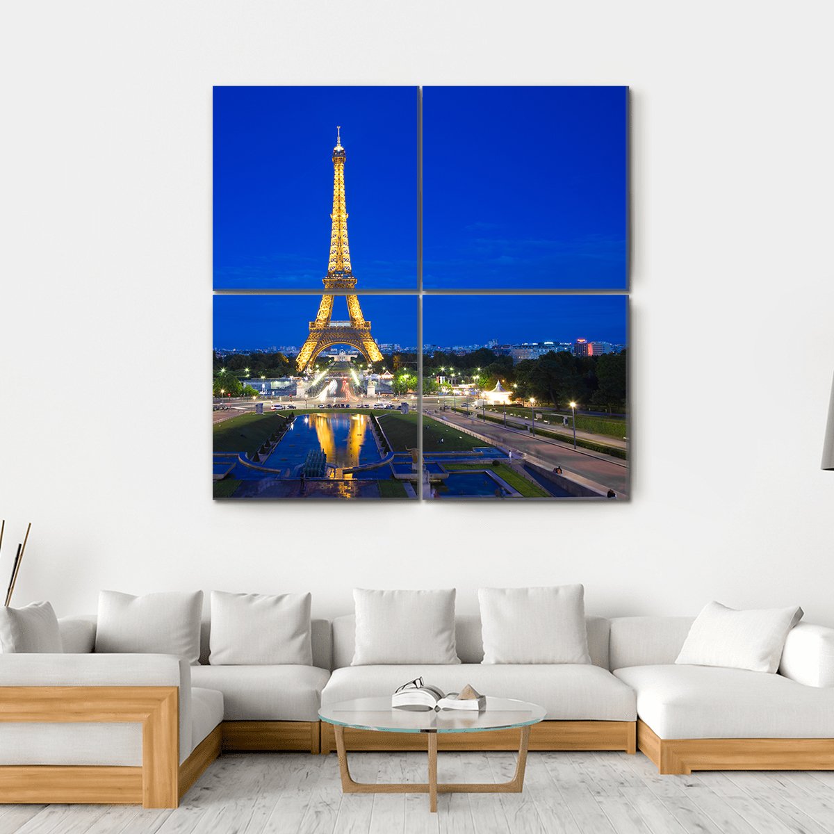 Eiffel Tower Illuminated at Twilight Canvas Wall Art in gold, yellow and blue, hung on a wall