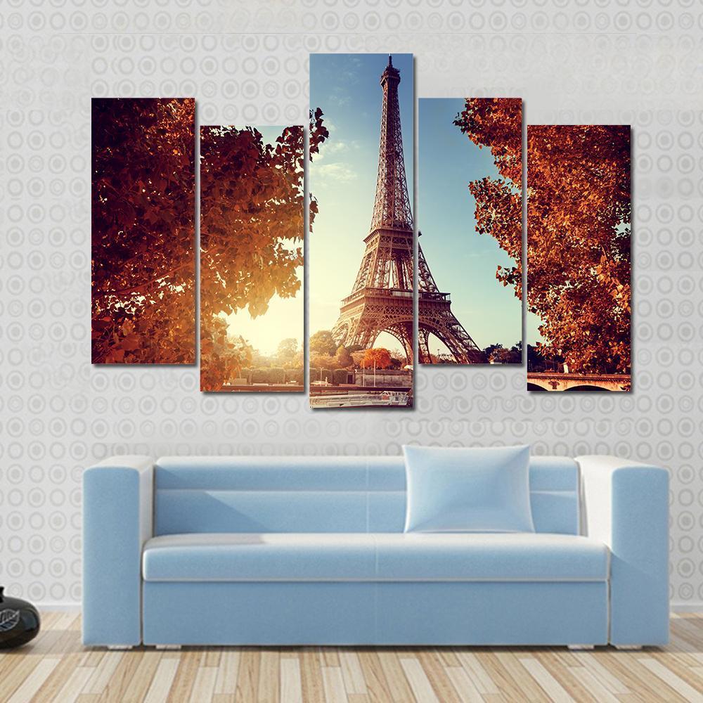 Eiffel Tower in Autumn Canvas Wall Art in brown, orange and blue, 5 panel Pop layout hung on a wall