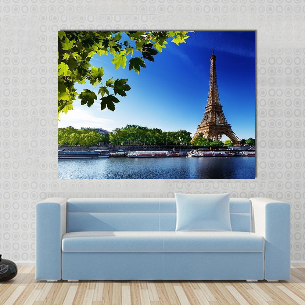 Eiffel Tower at Sunrise Canvas Wall Art in brown, green and blue, single panel hung on a wall