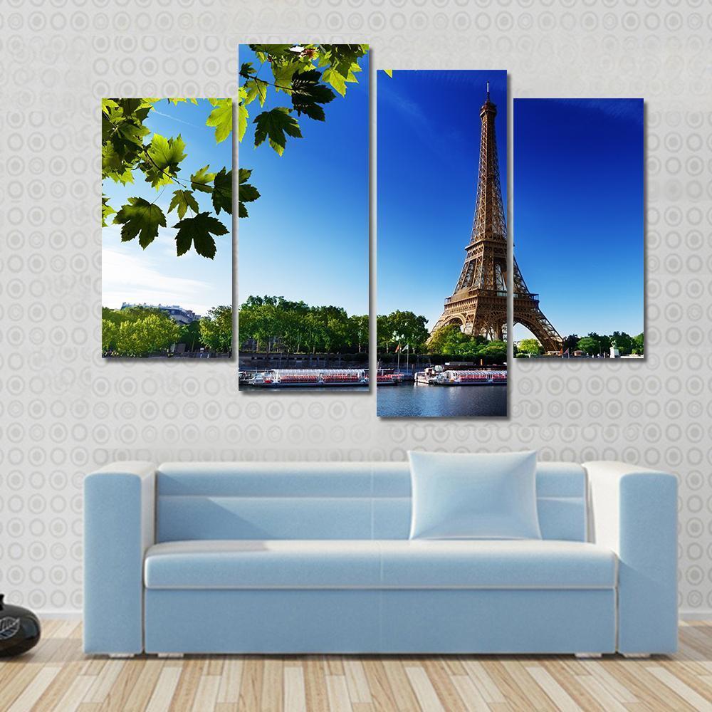 Eiffel Tower at Sunrise Canvas Wall Art in brown, green and blue, 3 panel horizontal set hung on a wall