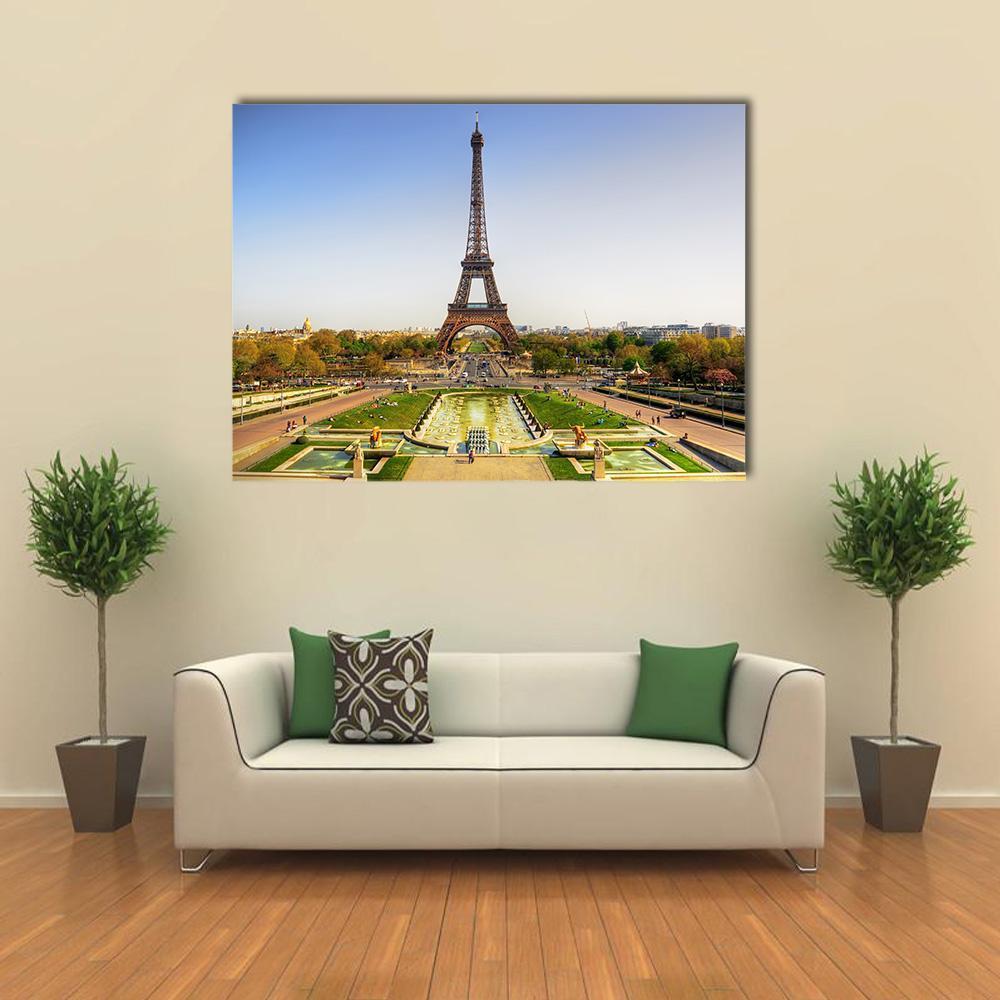 Eiffel Tower at Trocadéro Gardens Canvas Wall Art in yellow, green and blue, single panel hung on a wall