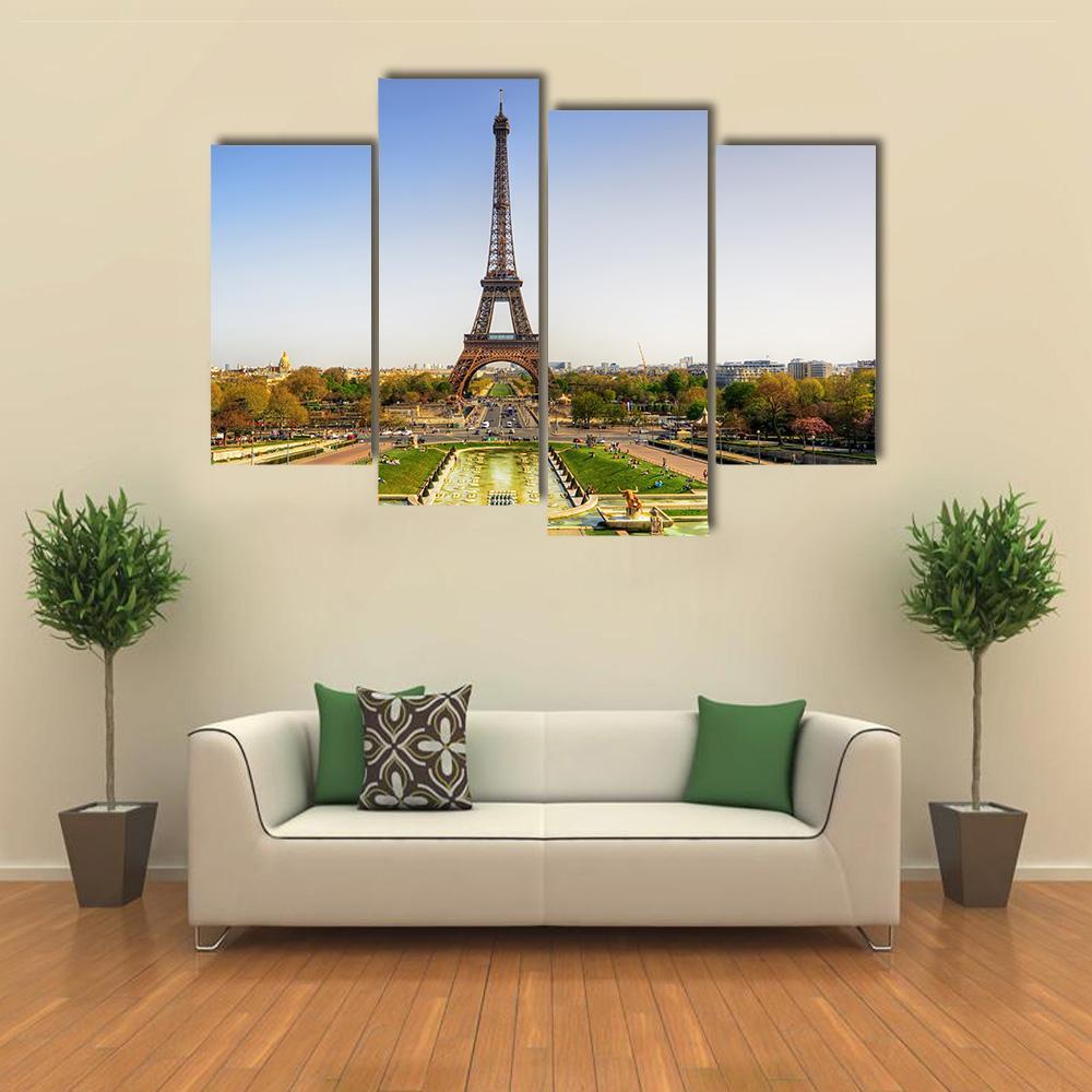 Eiffel Tower in Paris Canvas Wall Art in yellow, green and blue, 4 panel Pop layout hung on a wall
