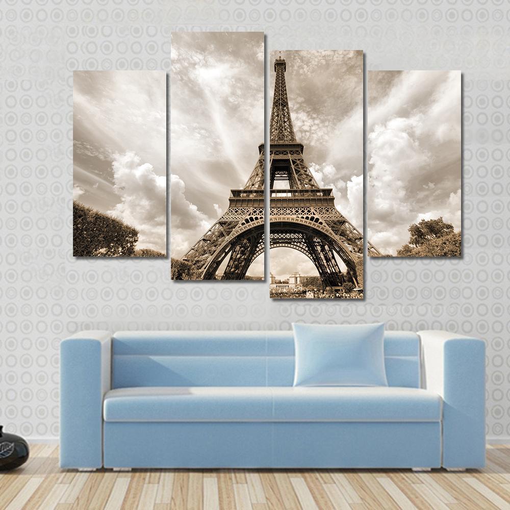 Eiffel Tower Under Clouds Canvas Wall Art in gray, beige and brown, 5 panel Pop layout hung on a wall