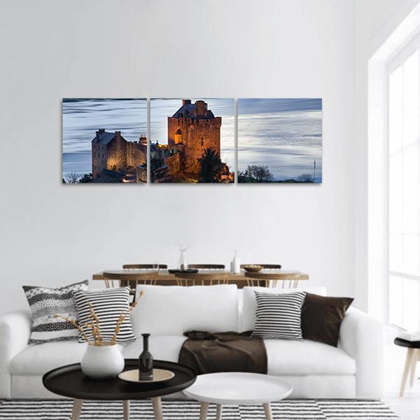 Eilean Donan Castle at Twilight Panoramic Canvas Wall Art in gray, brown and blue, hung on a wall