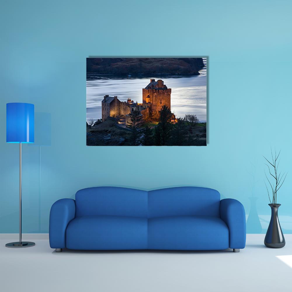 Eilean Donan Castle at Dusk Canvas Wall Art in brown, orange and blue, single panel hung on a wall