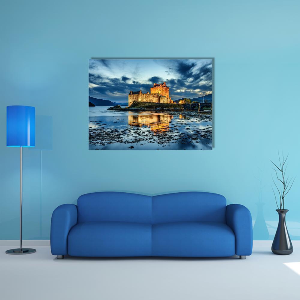 Eilean Donan Castle Sunset Reflection Canvas Wall Art in gold, orange and blue, single panel hung on a wall
