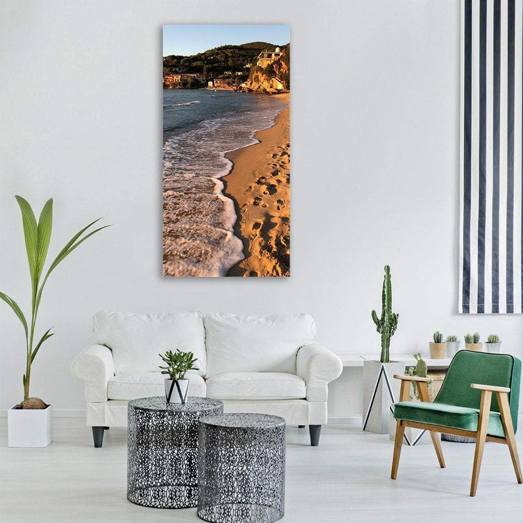 Elba Island Bay at Golden Hour Vertical Canvas Wall Art in brown, gold and blue, single vertical panel hung on a wall