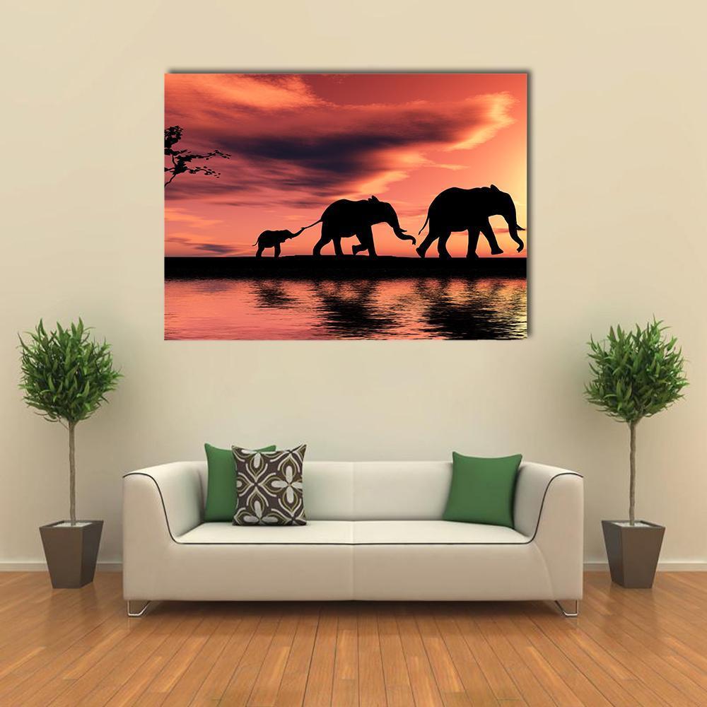 Elephant Family Silhouette Canvas Wall Art in black, orange and pink, single panel hung on a wall