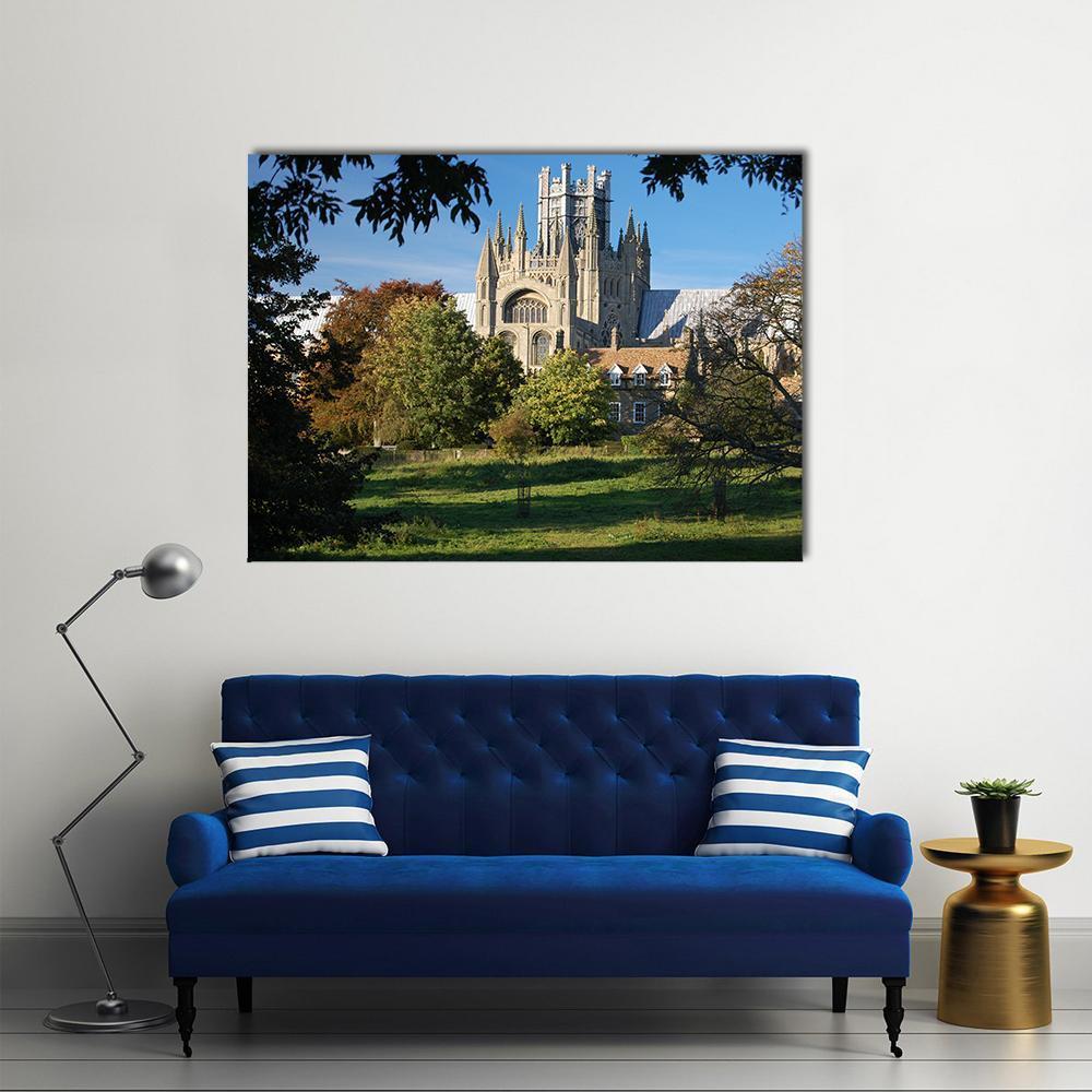 Ely Cathedral in Sunlit Field Canvas Wall Art in gray, green and blue, single panel hung on a wall