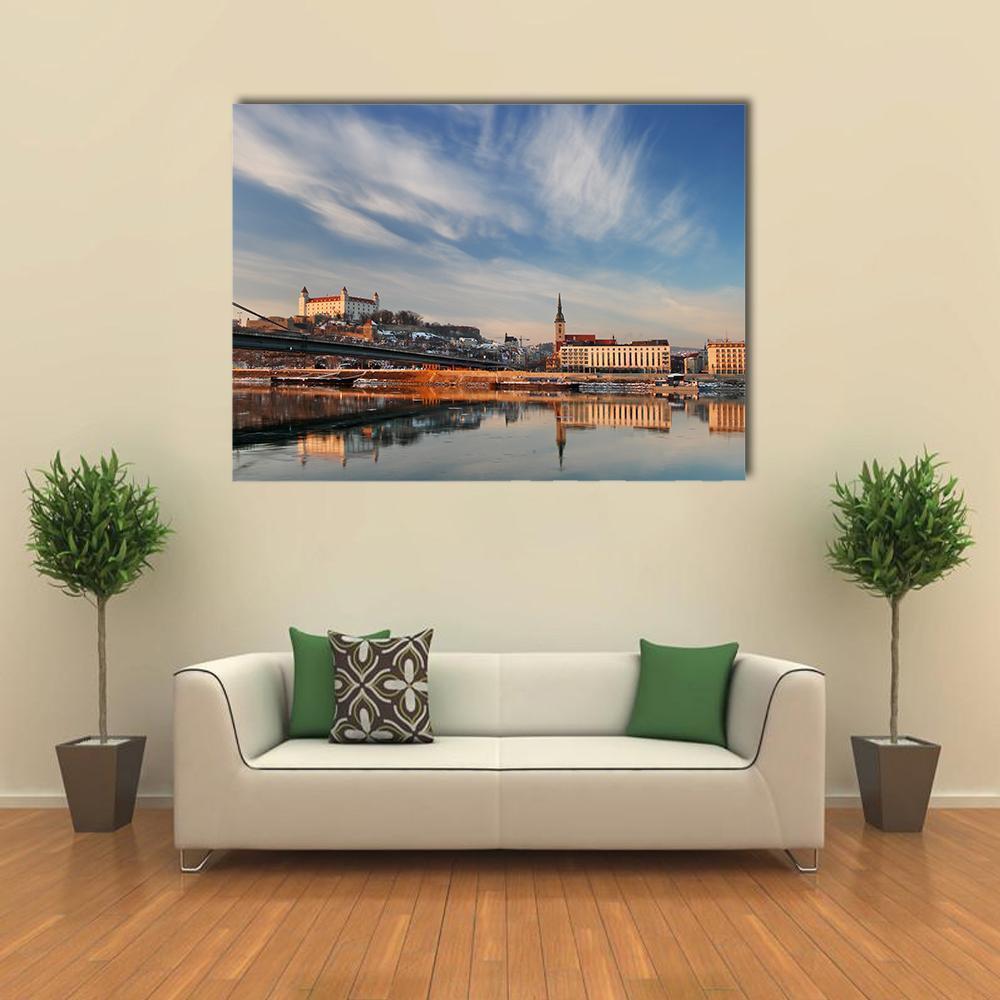 White Castle and Cathedral Reflected in River Canvas Wall Art in white, orange and blue, single panel hung on a wall