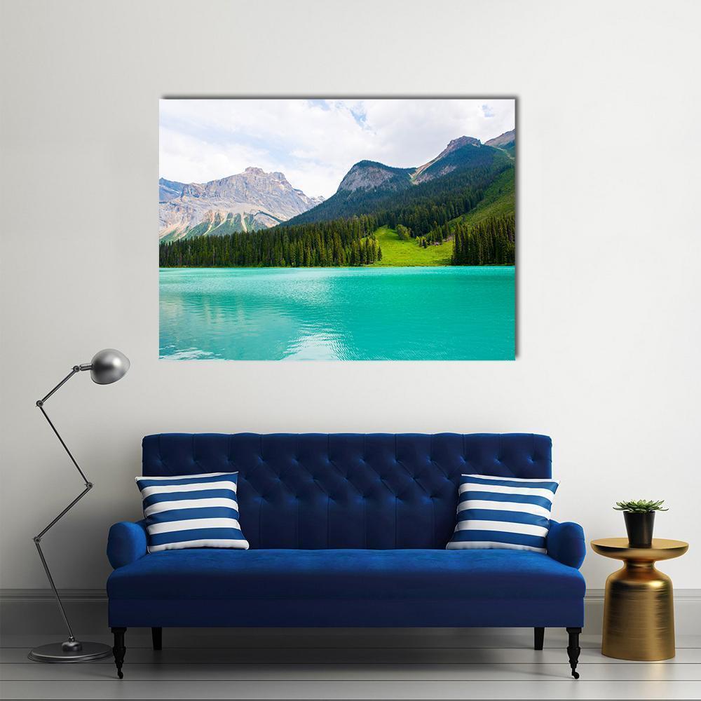 Emerald Lake with Alpine Pines Canvas Wall Art in gray, green and blue, single panel hung on a wall
