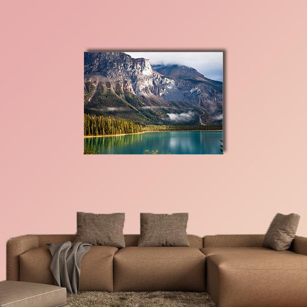 Emerald Lake with Mountain Peaks Canvas Wall Art in gray, green and blue, single panel hung on a wall