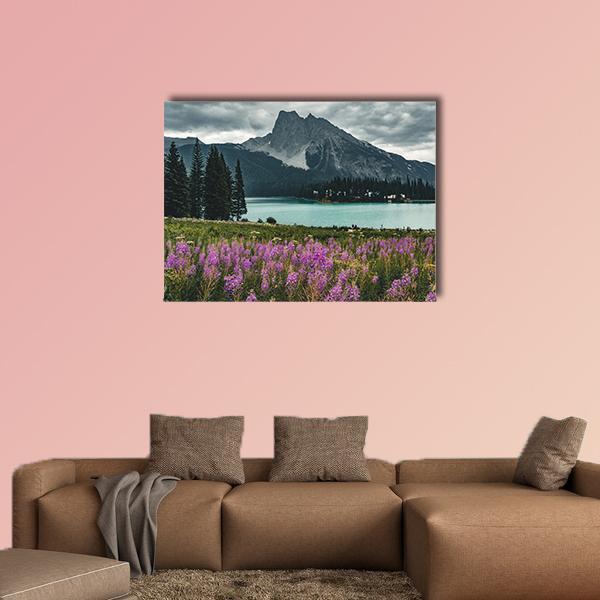 Emerald Lake with Mountains Canvas Wall Art in gray, green and purple, single panel hung on a wall