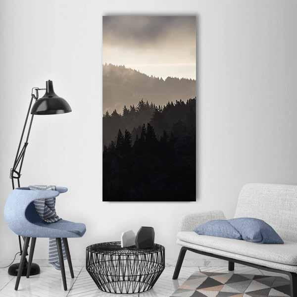 Endless Misty Pine Forest Vertical Canvas Wall Art in black, gray and beige, single vertical panel hung on a wall