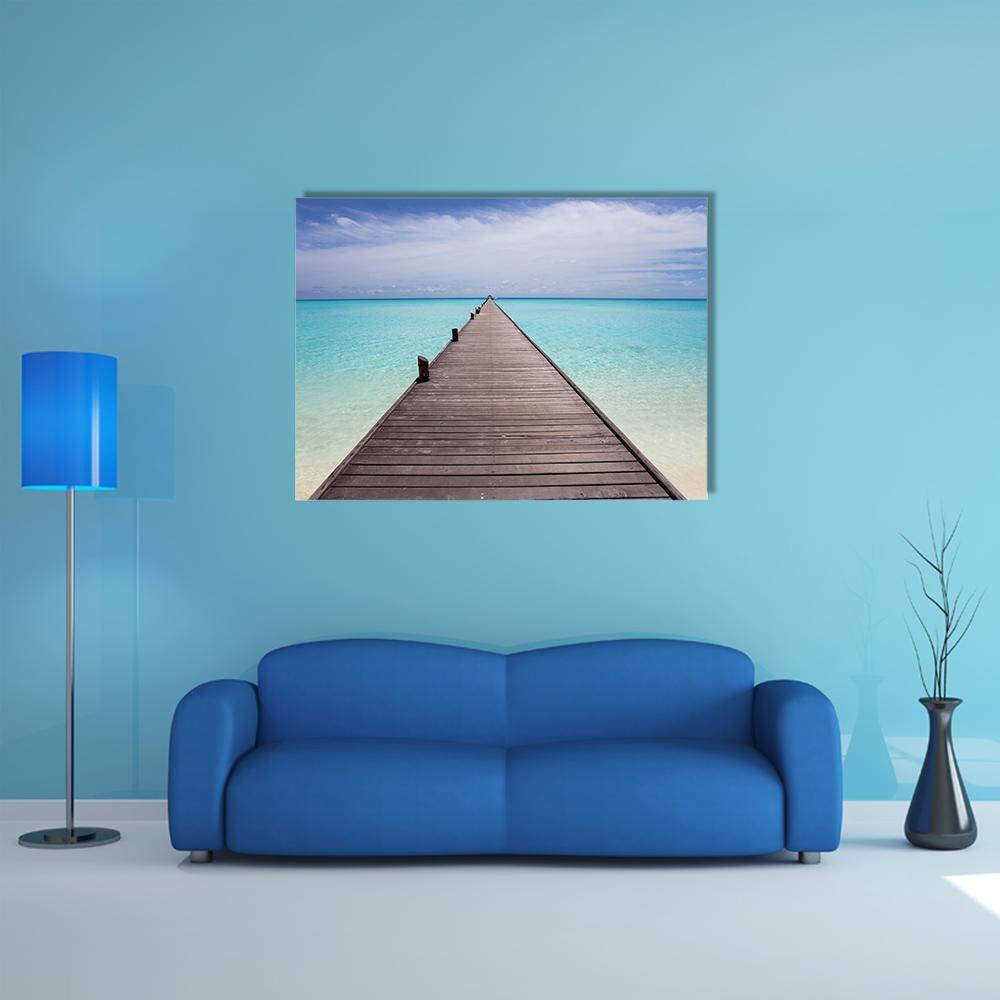Endless Pier to Turquoise Horizon Canvas Wall Art in white, brown and blue, single panel hung on a wall
