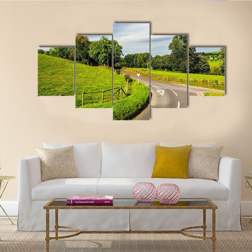 English Country Panorama Around Salisbury Canvas Wall Art in gray, green and blue, 5 panel Star layout hung on a wall