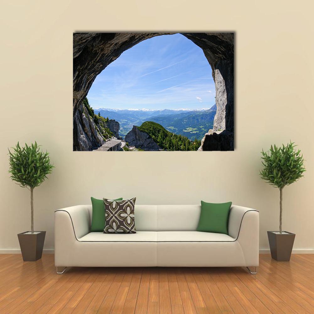 View from Inside Mountain Cave Canvas Wall Art in gray, green and blue, single panel hung on a wall