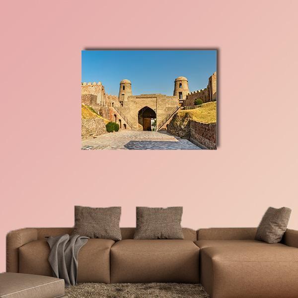 Entrance of Hisor Fortress Canvas Wall Art in beige, brown and blue, single panel hung on a wall