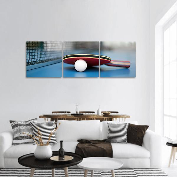 Table Tennis Paddle and Ball Panoramic Canvas Wall Art in white, red and blue, hung on a wall