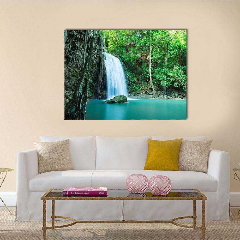 Erawan Tropical Waterfall Canvas Wall Art in white, green and blue, single panel hung on a wall