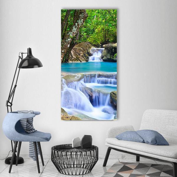 Erawan Waterfall in Kanchanaburi Vertical Canvas Wall Art in white, green and blue, single vertical panel hung on a wall