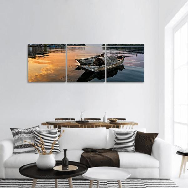 Erhai Lake Sampans at Sunset Panoramic Canvas Wall Art in black, orange and blue, hung on a wall
