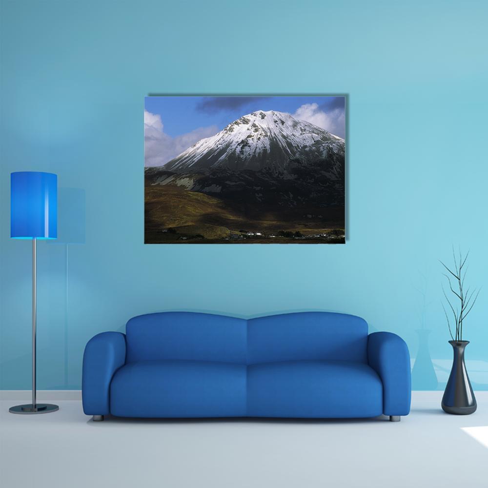 Errigal Mountain with Village and Snow Canvas Wall Art in white, gray and blue, single panel hung on a wall