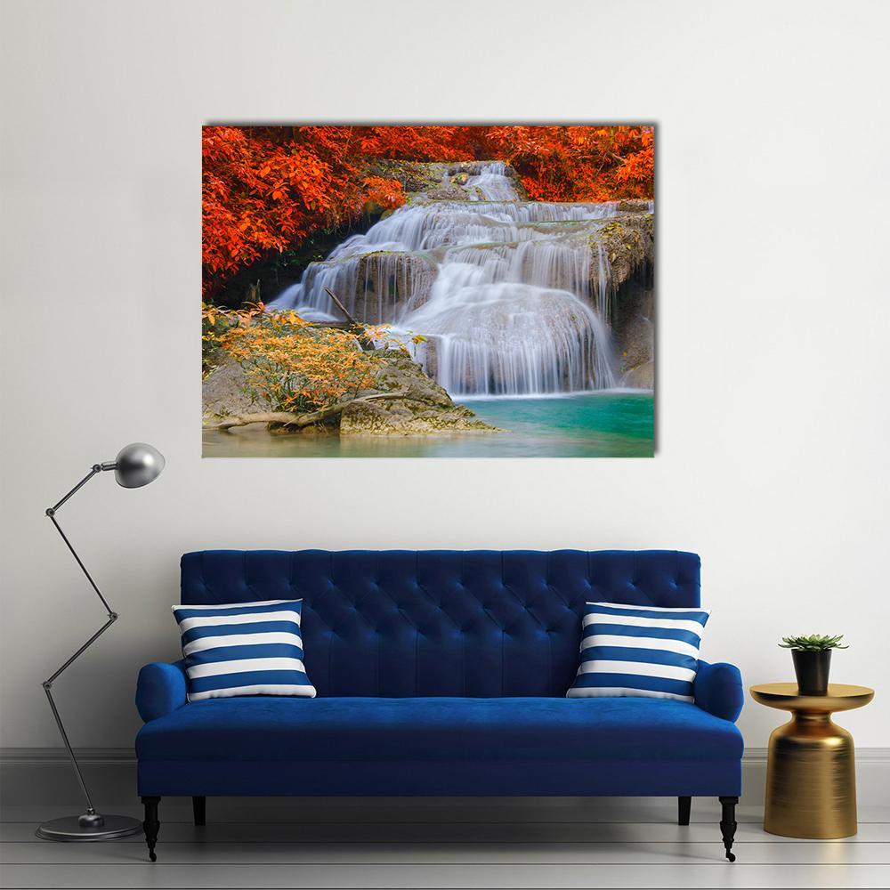 Erwan Waterfall with Turquoise Pool Canvas Wall Art in white, red and blue, single panel hung on a wall